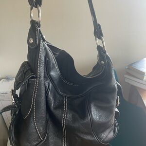 Tod’s large black tote bag in very good condition. So marks or stains.